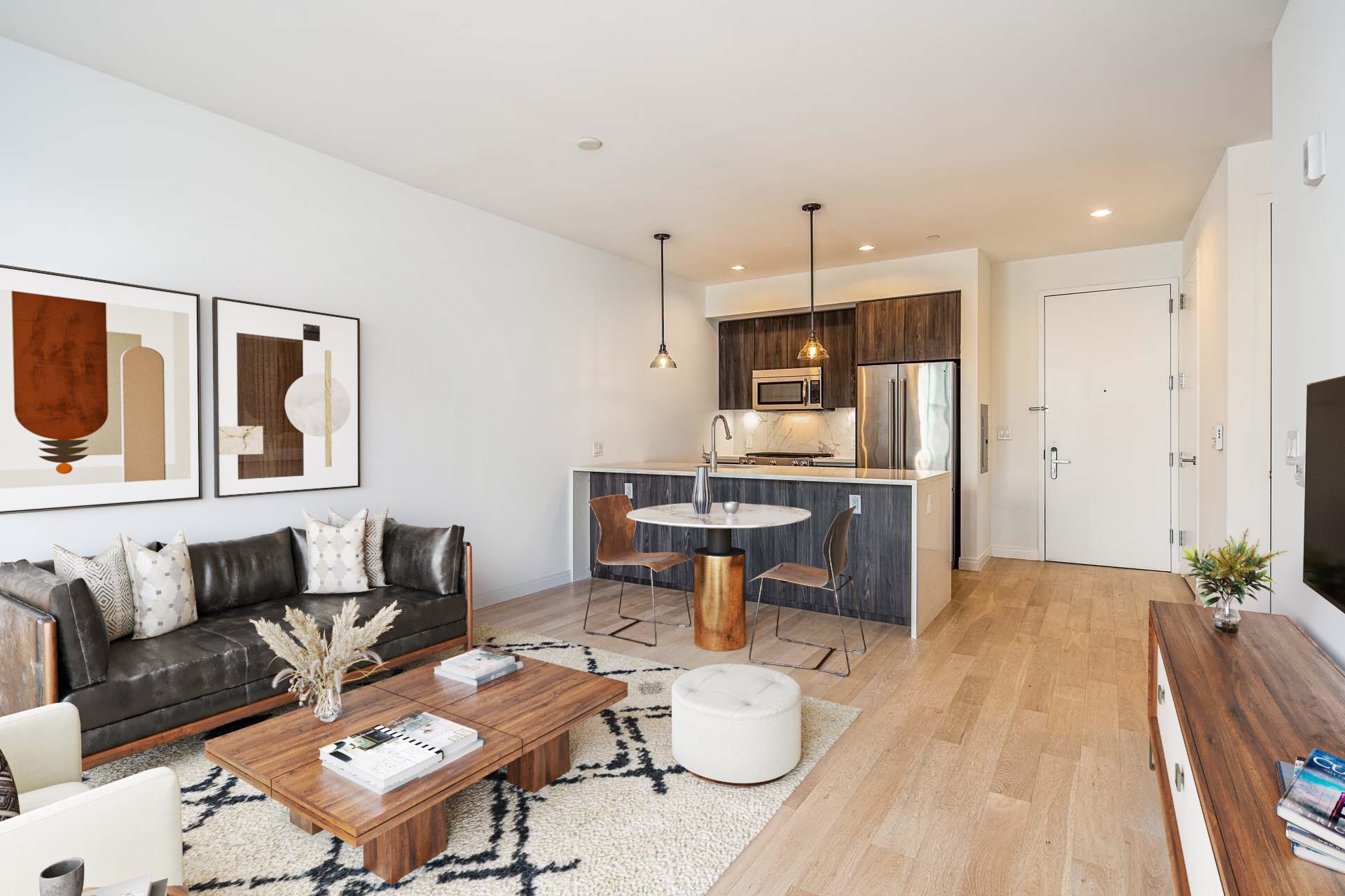 a living room with furniture and kitchen view