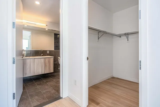 a view of a room with wooden floor