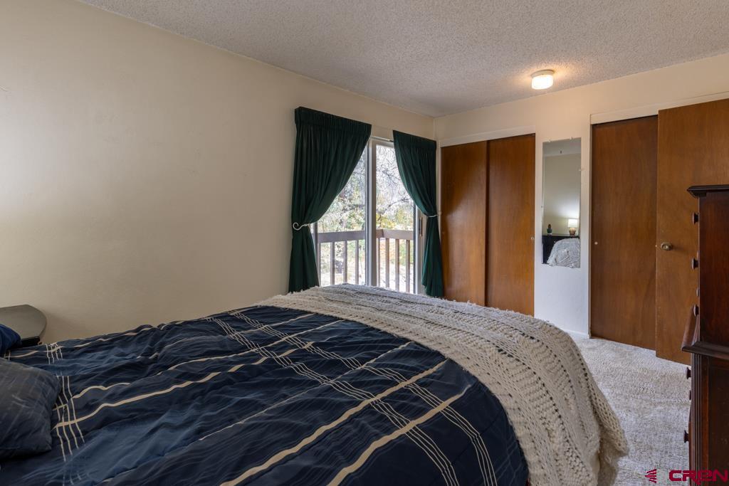 1851 Florida Road, Unit 106 Durango, CO 81301 - Photo 19 of 25 a bedroom with a bed and a window