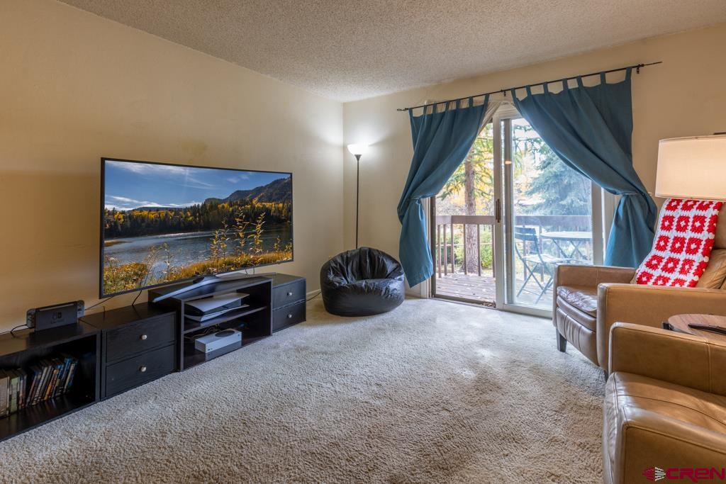 1851 Florida Road, Unit 106 Durango, CO 81301 - Photo 3 of 25 a livingroom with workspace and a window
