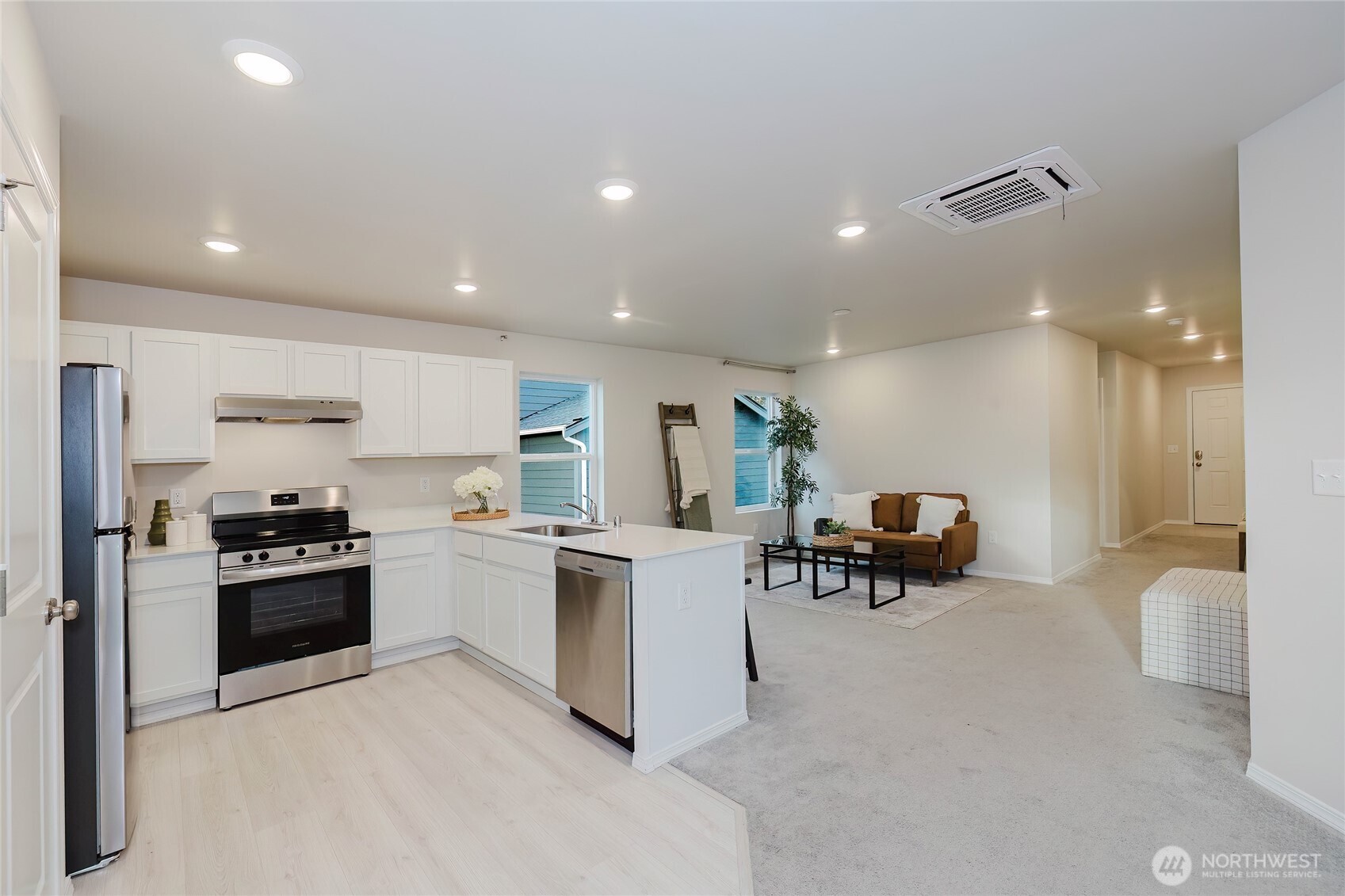 240 Northeast Olympic Ridge Belfair, WA 98528 - Photo 12 of 28 a kitchen with a sink and a stove top oven