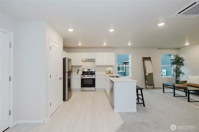 a room with sink and mirror
