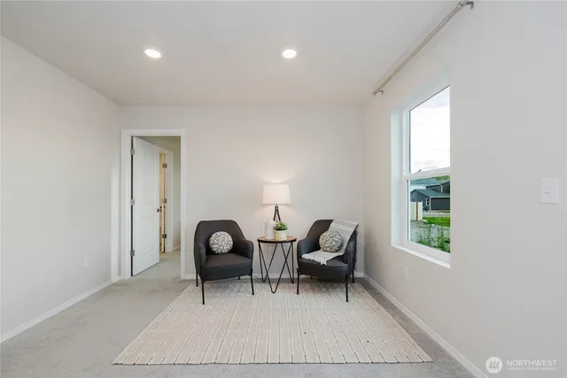 a bedroom with a bed and a night stand