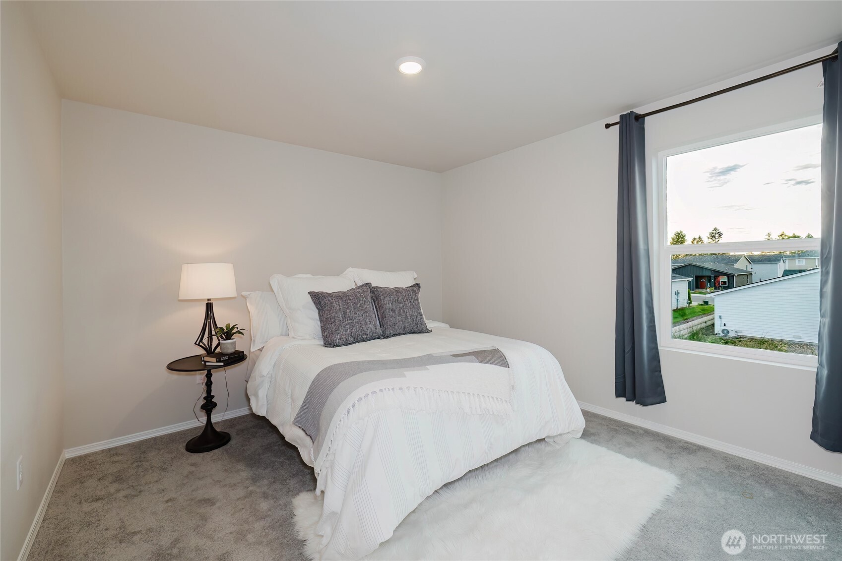 240 Northeast Olympic Ridge Belfair, WA 98528 - Photo 19 of 28 a bedroom with a bed and a night stand