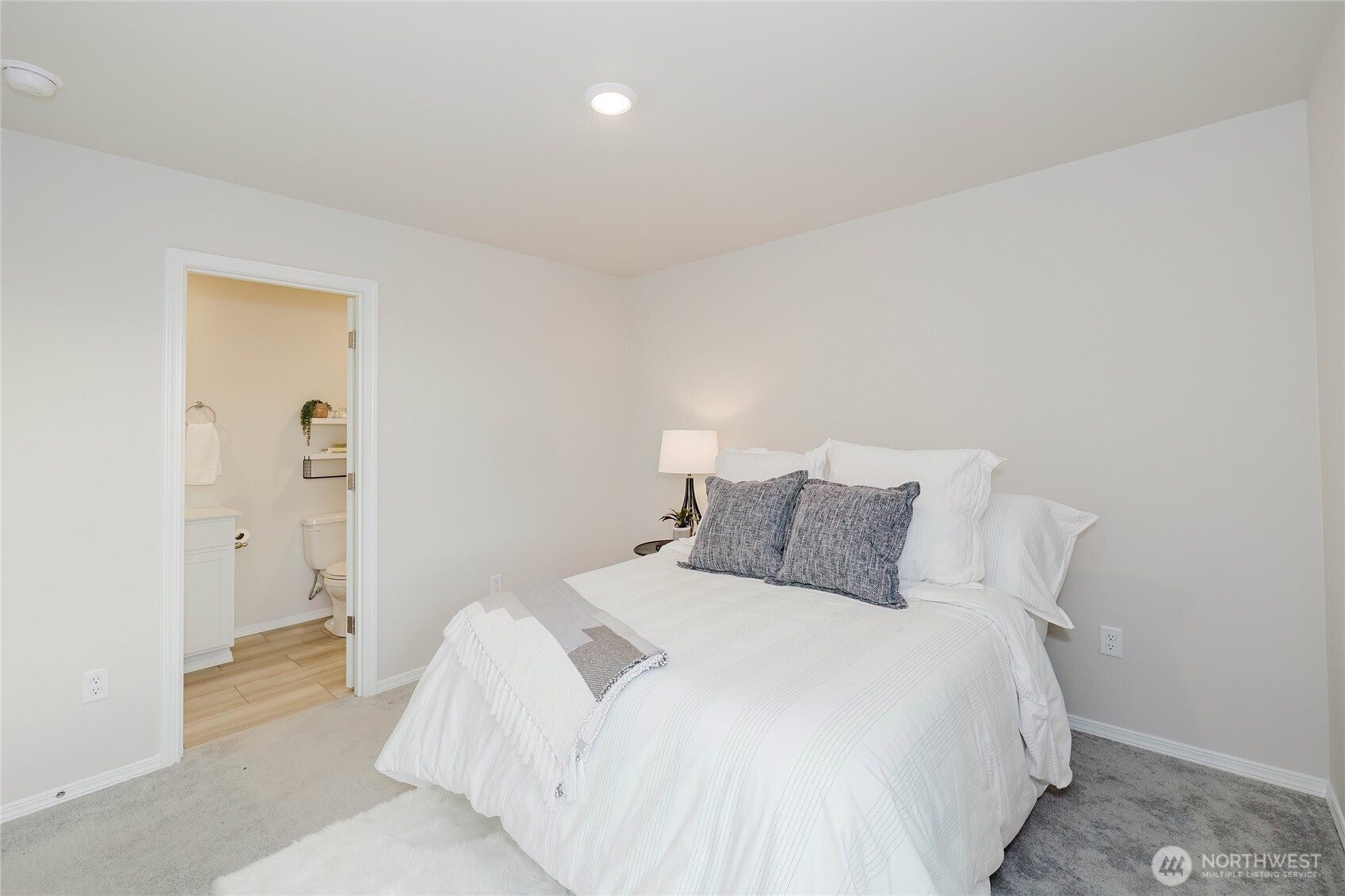 240 Northeast Olympic Ridge Belfair, WA 98528 - Photo 21 of 28 a bedroom with a bed and closet