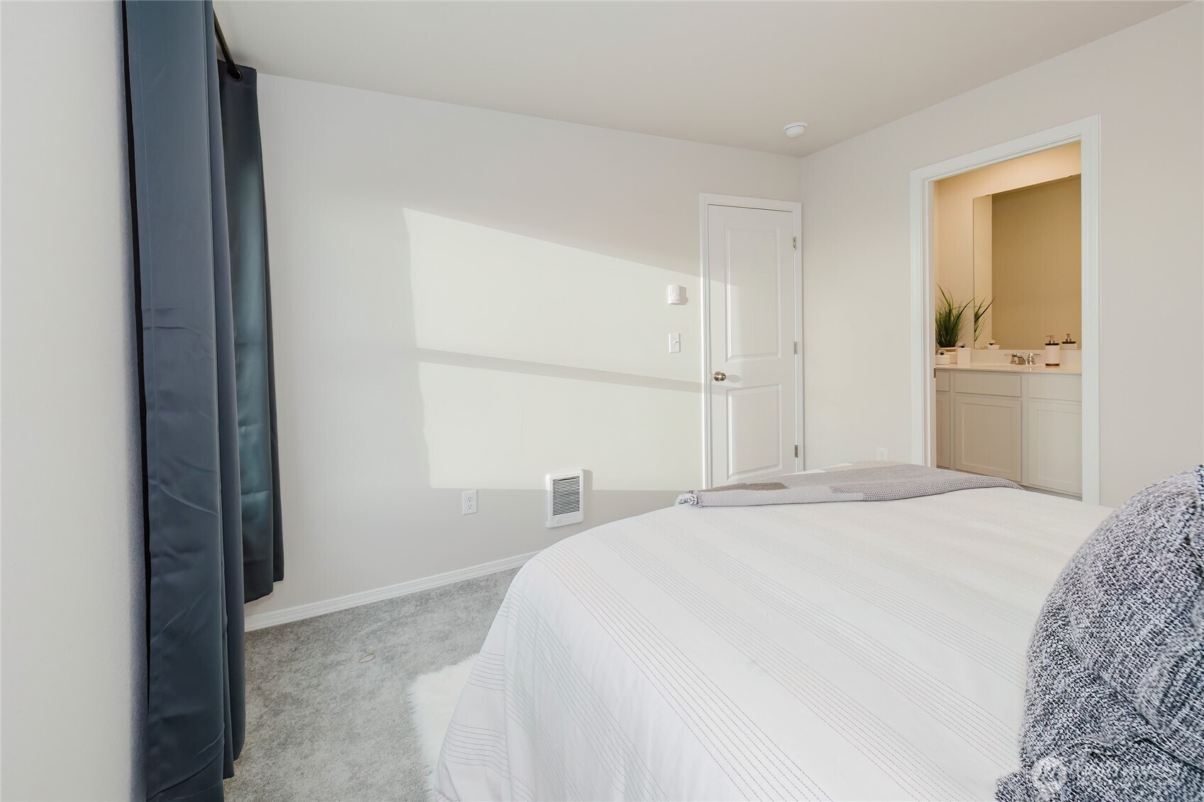 240 Northeast Olympic Ridge Belfair, WA 98528 - Photo 22 of 28 a bedroom with a bed and a view of bathroom