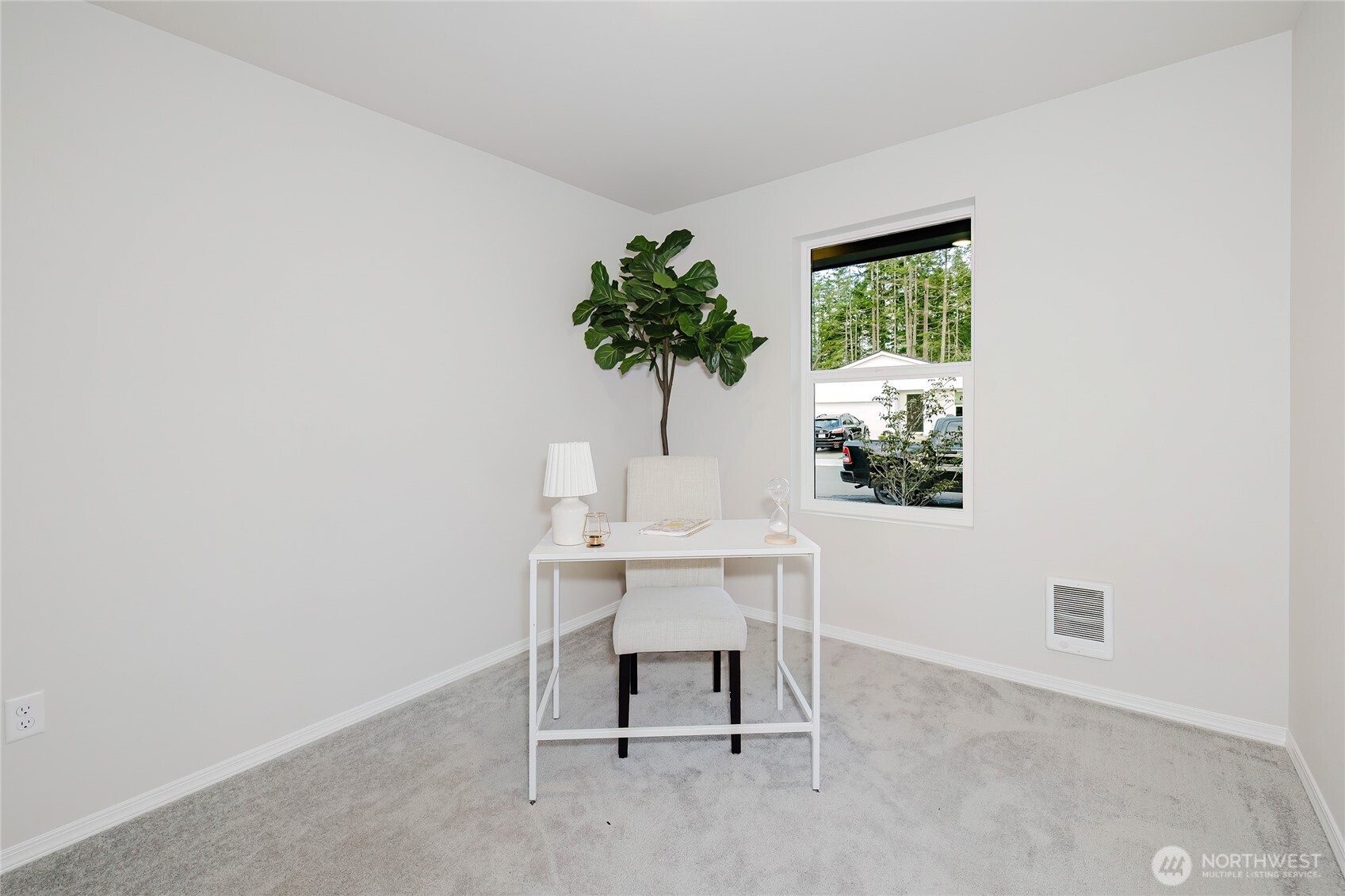 240 Northeast Olympic Ridge Belfair, WA 98528 - Photo 24 of 28 a view of a workspace with a table and a potted plant