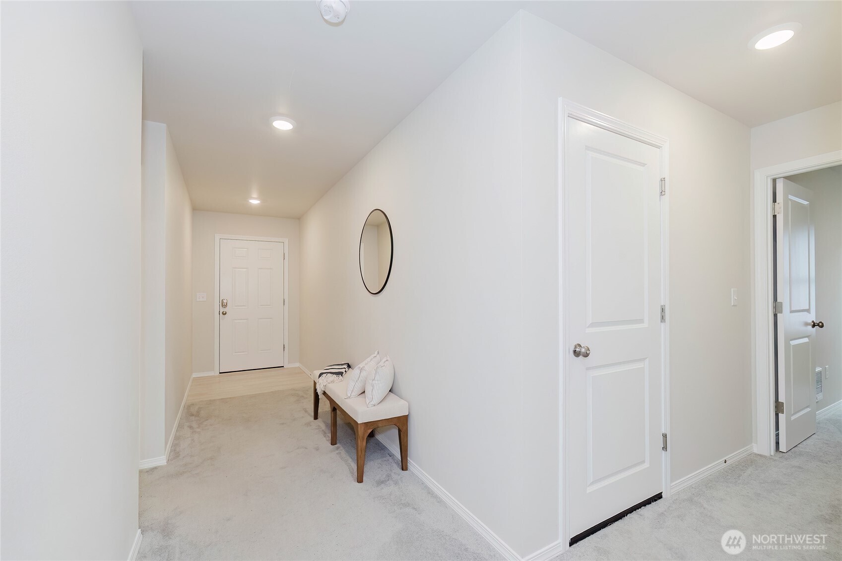 240 Northeast Olympic Ridge Belfair, WA 98528 - Photo 4 of 28 a view of a room with wooden floor mirror and windows