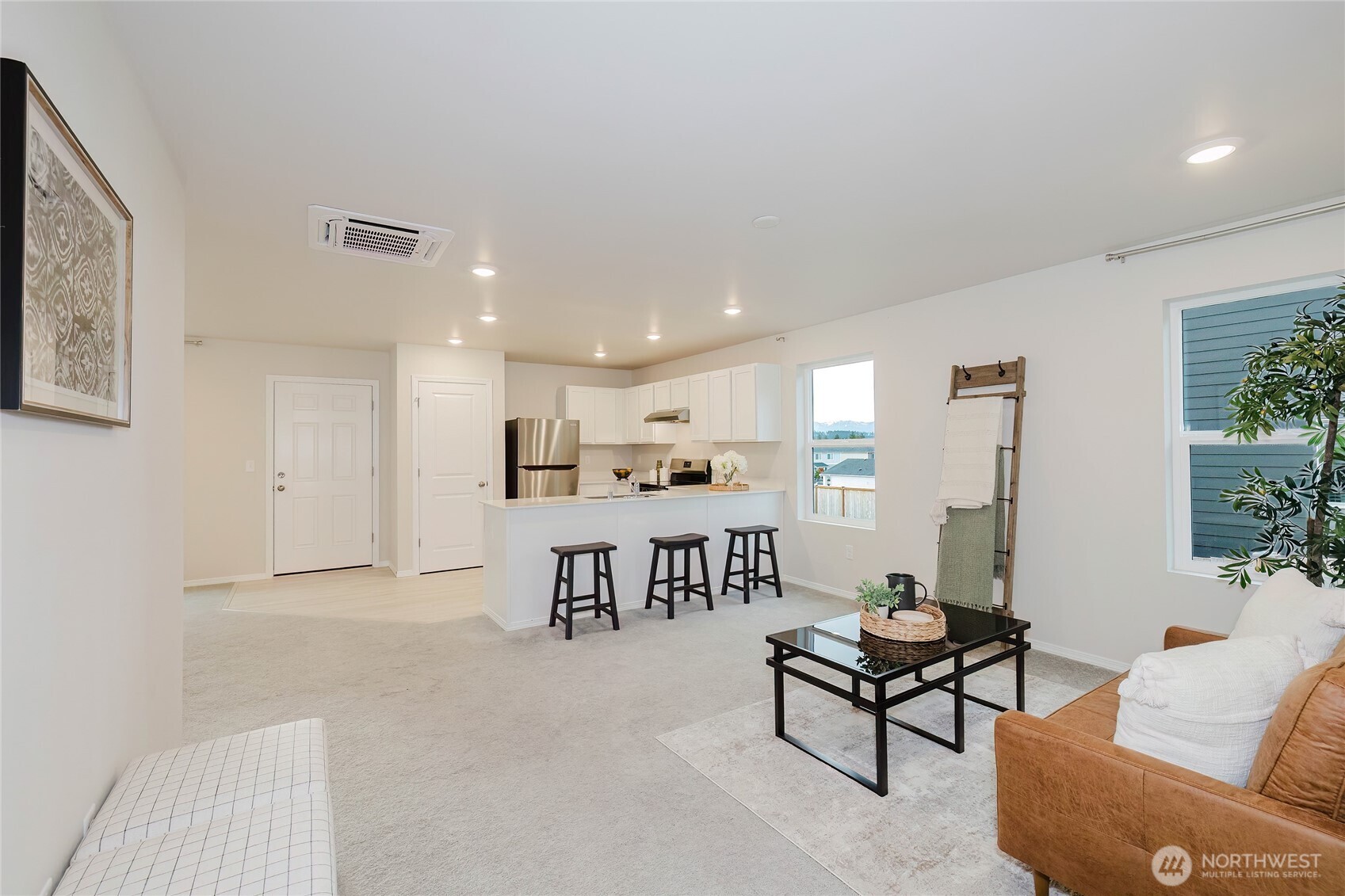 240 Northeast Olympic Ridge Belfair, WA 98528 - Photo 6 of 28 a view of a livingroom with furniture and a couch