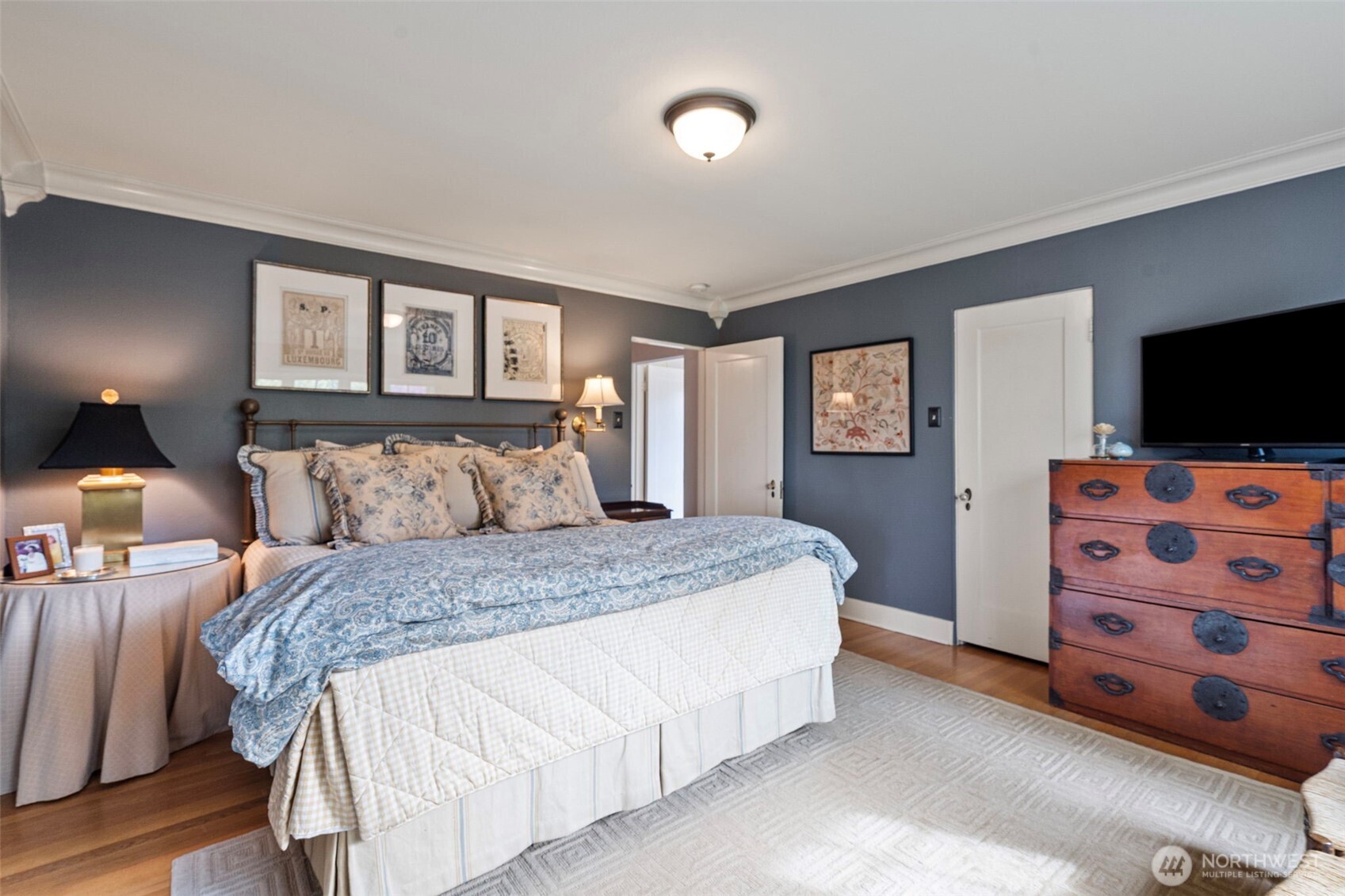 659 Alta Vista Place Fircrest, WA 98466 - Photo 20 of 40 a bedroom with a bed and a tv on the dresser