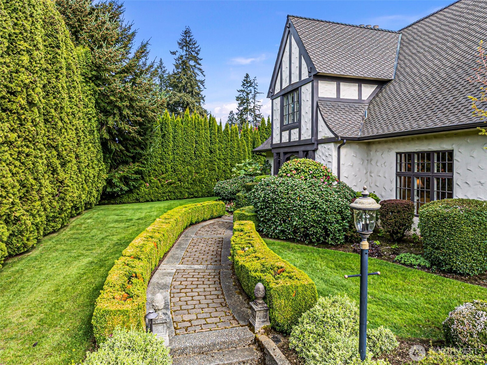 659 Alta Vista Place Fircrest, WA 98466 - Photo 39 of 40 a view of a house with swimming pool and garden