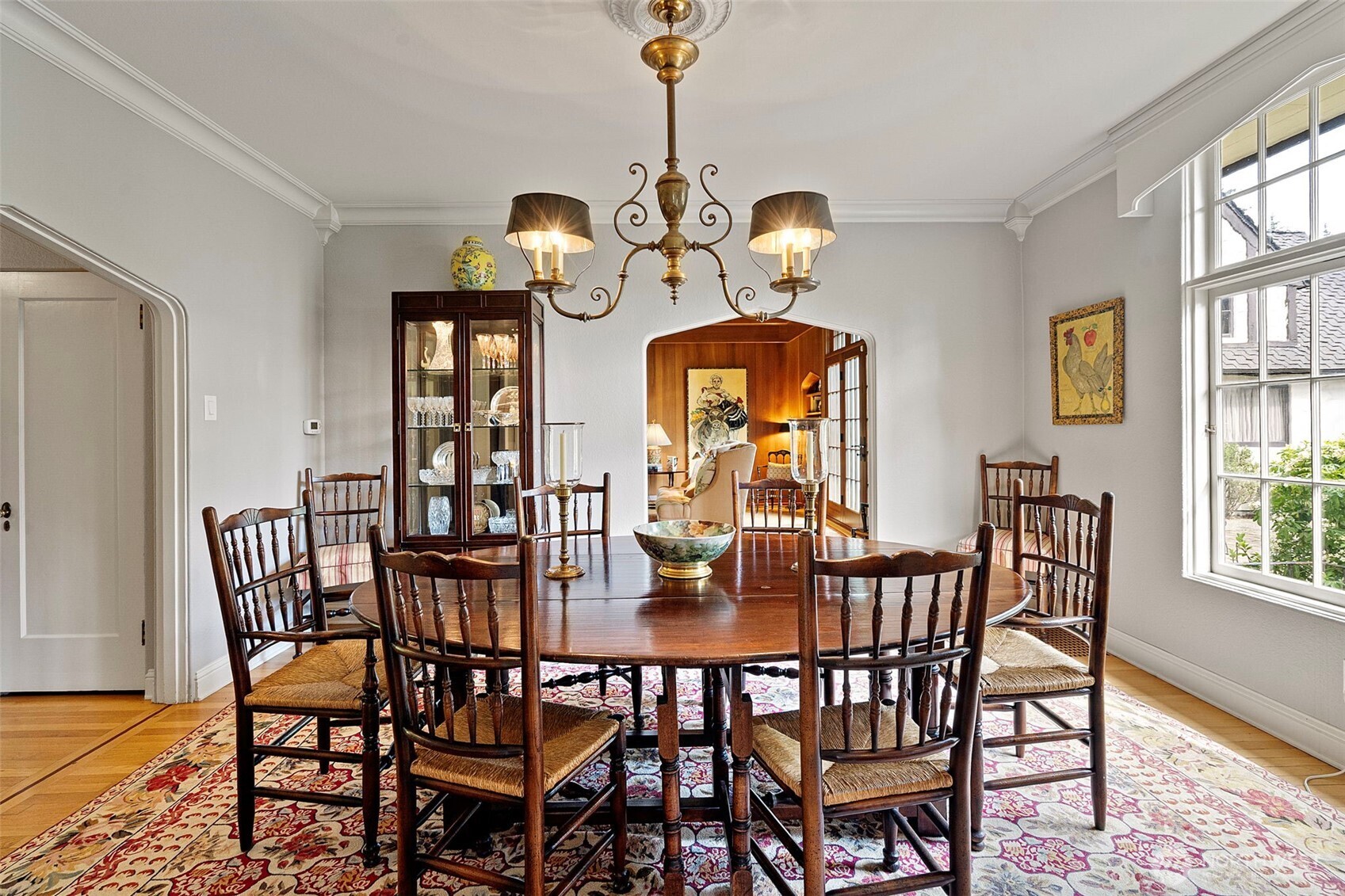 659 Alta Vista Place Fircrest, WA 98466 - Photo 9 of 40 a view of a dining room with furniture a chandelier and wooden floor