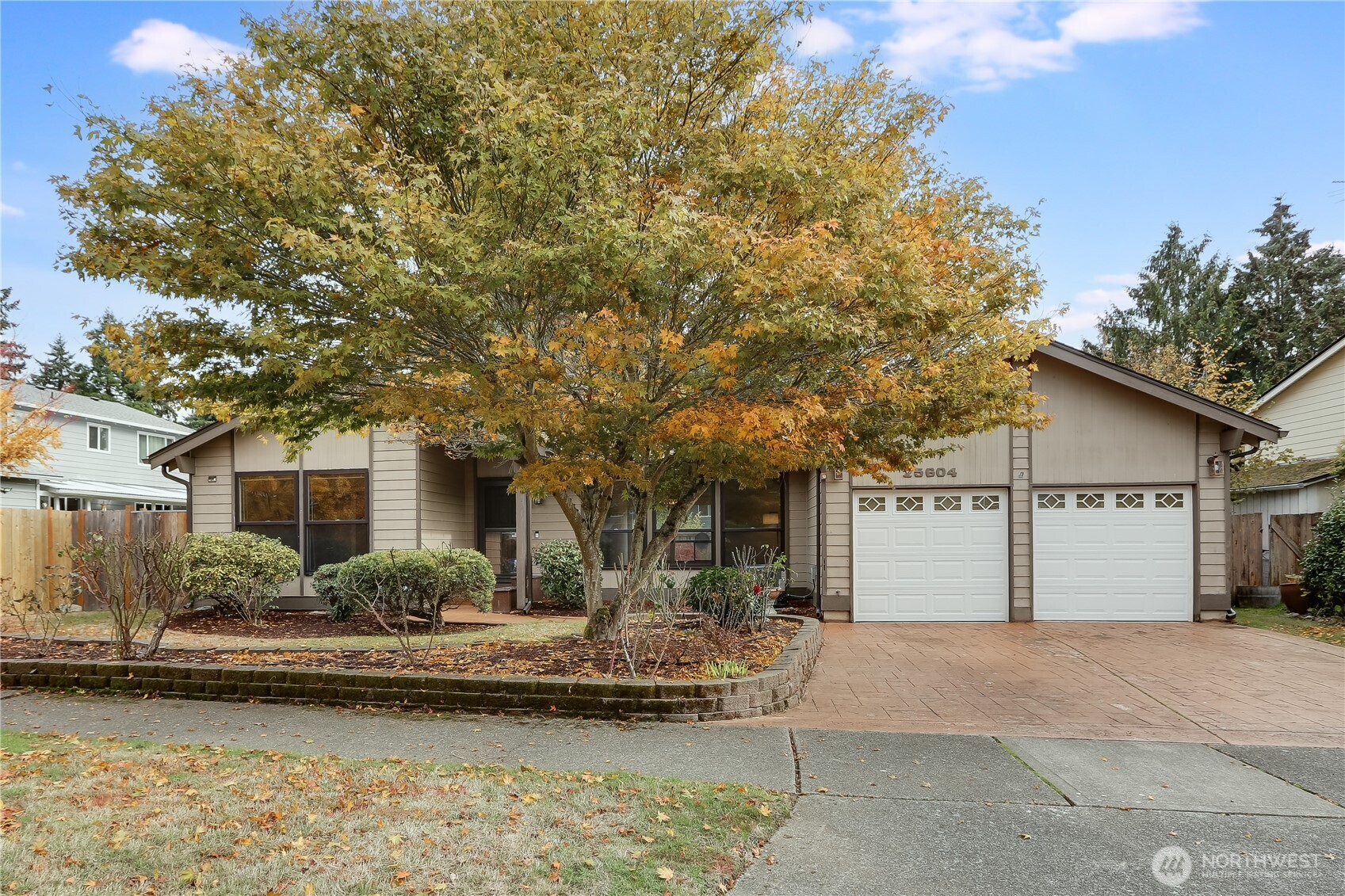 25604 36th Place South Kent, WA 98032 - Photo 1 of 30 a front view of a house with a garden and swimming pool