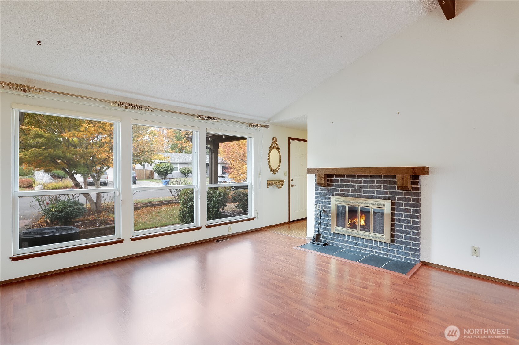 25604 36th Place South Kent, WA 98032 - Photo 5 of 30 a view of livingroom with furniture wooden floor and fireplace