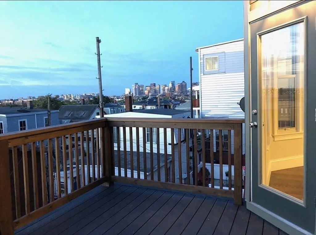 249 Lexington Street, Unit 2 Boston, MA 02128 - Photo 18 of 19 a view of a balcony with wooden floor
