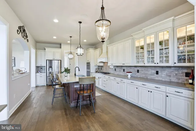 a view of a dining room with furniture wooden floor and chandelier