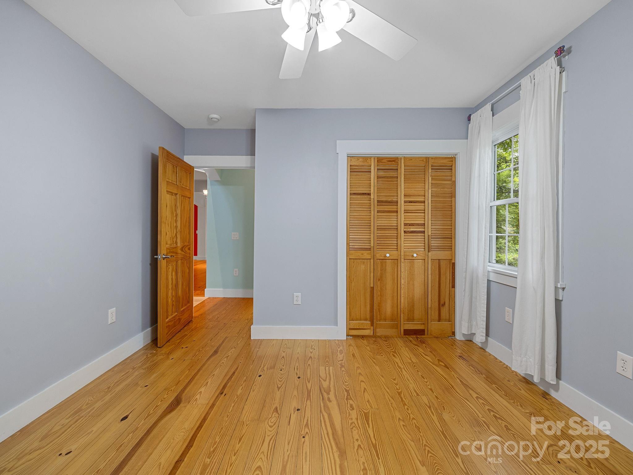 147 Woodland Road Tryon, NC 28782 - Photo 27 of 48 wooden floor in an empty room with a window