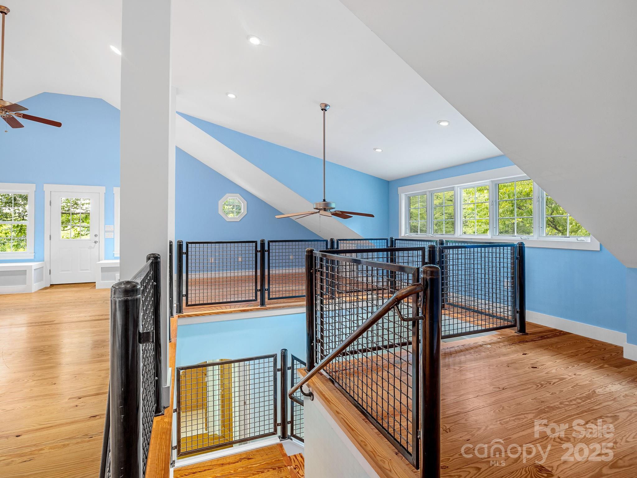 147 Woodland Road Tryon, NC 28782 - Photo 30 of 48 a view of an entryway with a floor to ceiling window and wooden floor
