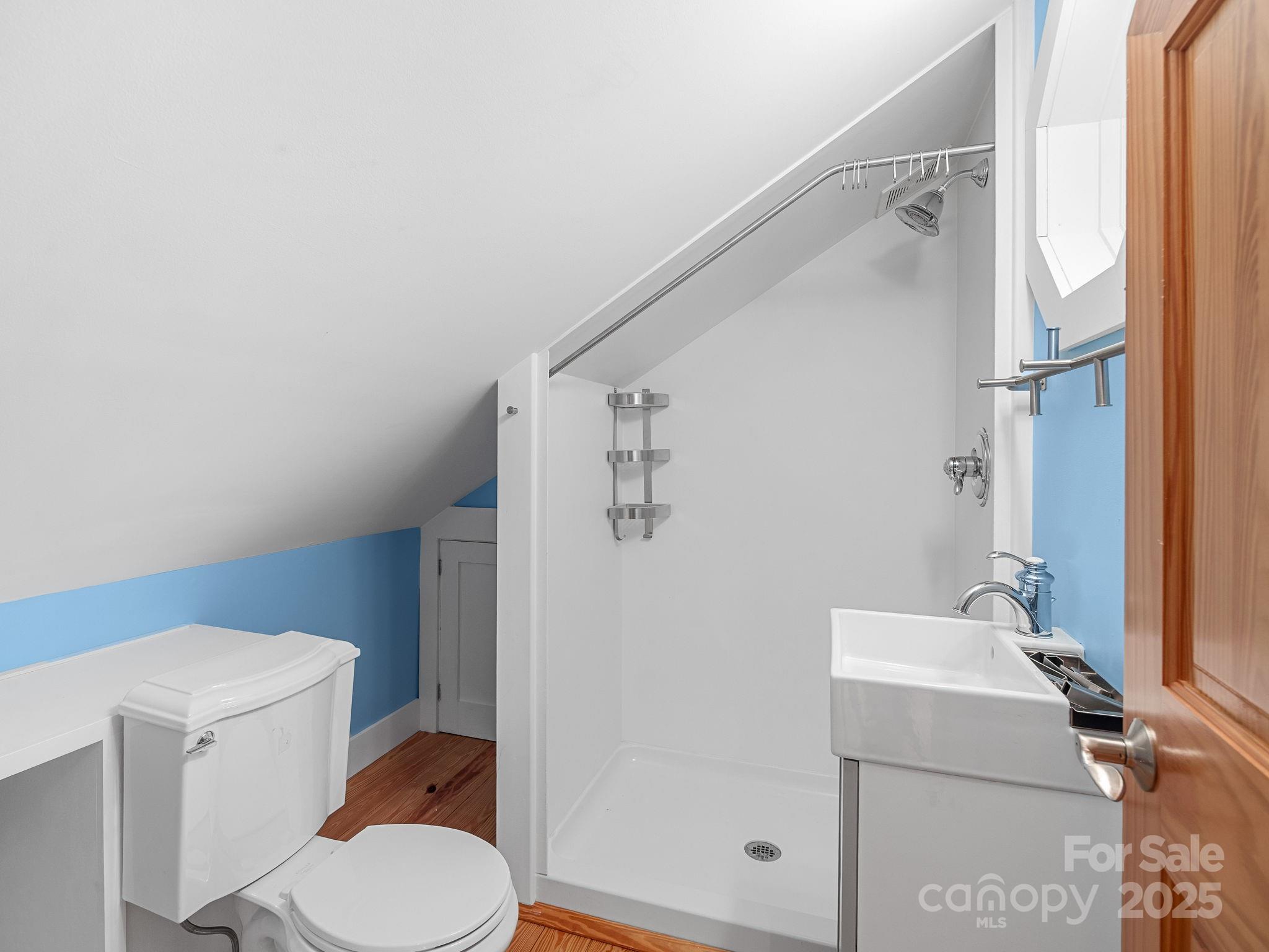 147 Woodland Road Tryon, NC 28782 - Photo 35 of 48 a bathroom with a sink toilet and shower