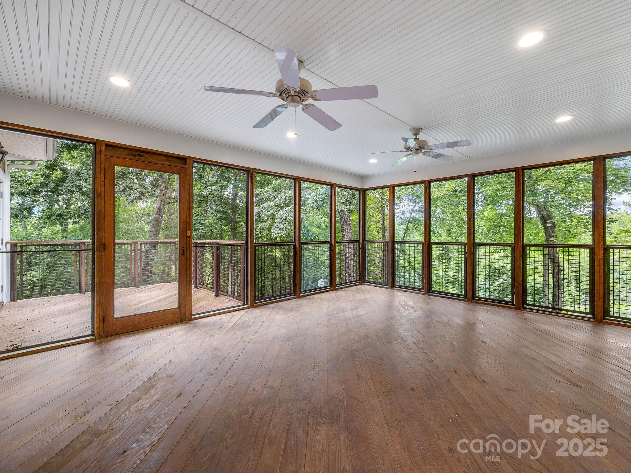 147 Woodland Road Tryon, NC 28782 - Photo 40 of 48 a view of an empty room with a large window