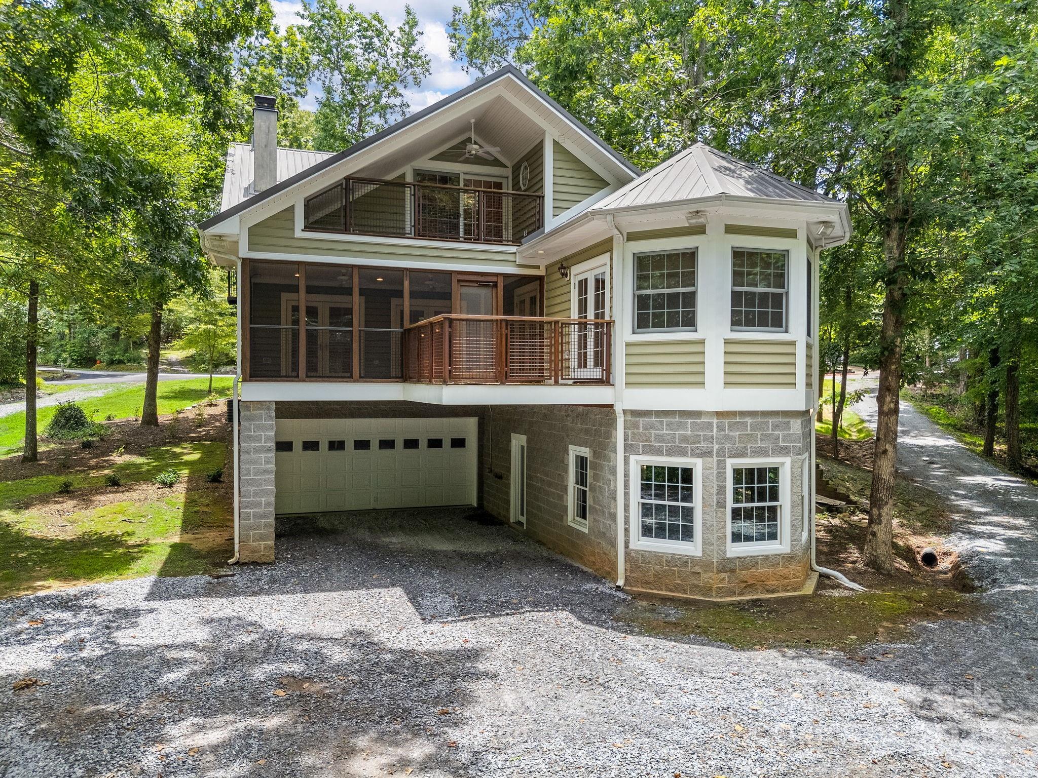 147 Woodland Road Tryon, NC 28782 - Photo 44 of 48 a front view of a house with a yard