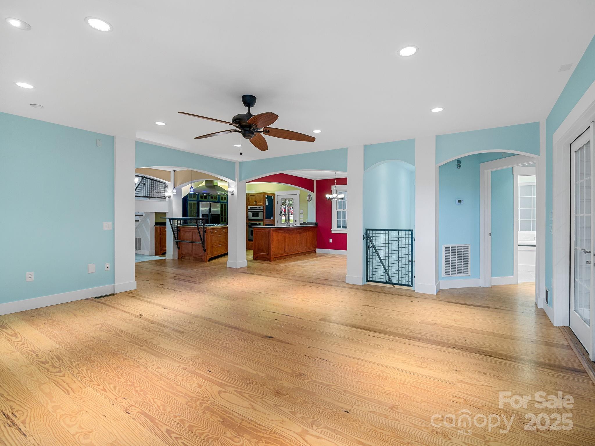 147 Woodland Road Tryon, NC 28782 - Photo 9 of 48 a view of a livingroom with furniture and a ceiling fan