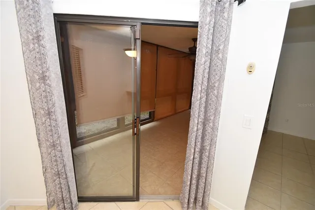 a bathroom with a glass door shower and a sink