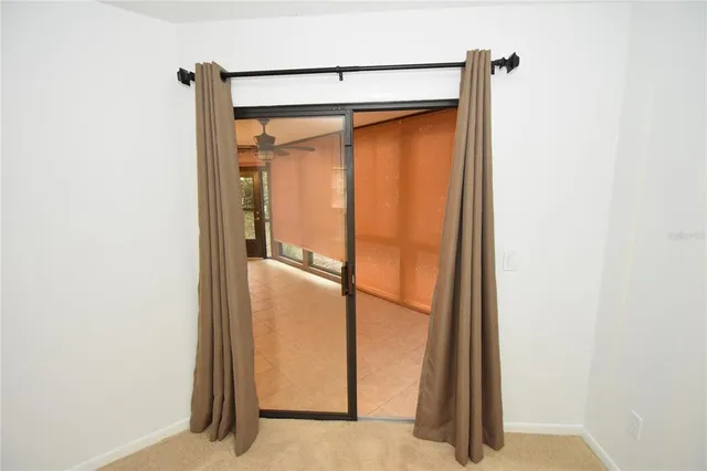 a view of a hallway with a chandelier