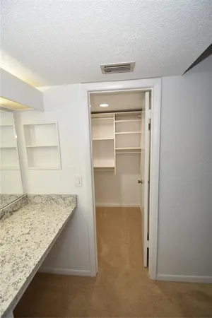 a view of a bathroom from a hallway