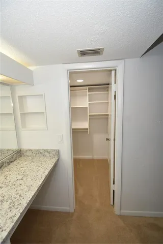 a view of a bathroom from a hallway