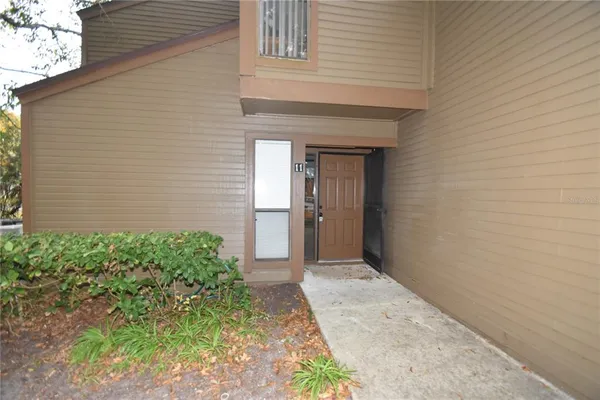 a view of backyard with sitting area