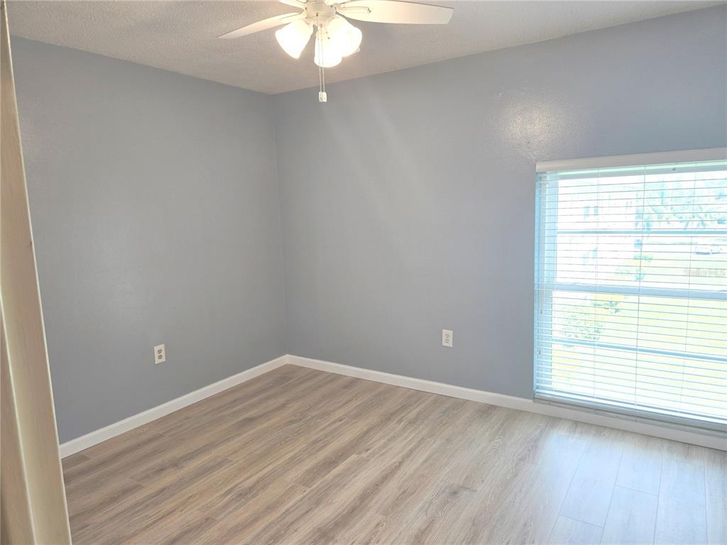 2700 Bayshore Boulevard, Unit 1302 Dunedin, FL 34698 - Photo 17 of 40 an empty room with a window