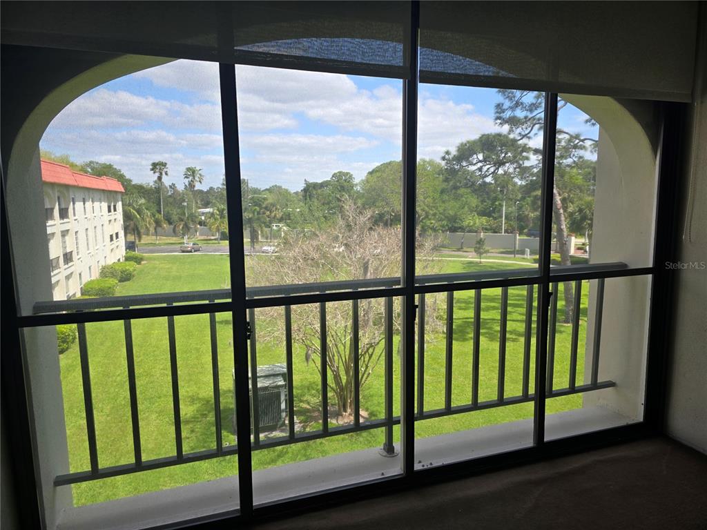 2700 Bayshore Boulevard, Unit 1302 Dunedin, FL 34698 - Photo 2 of 40 a view of a street from a balcony