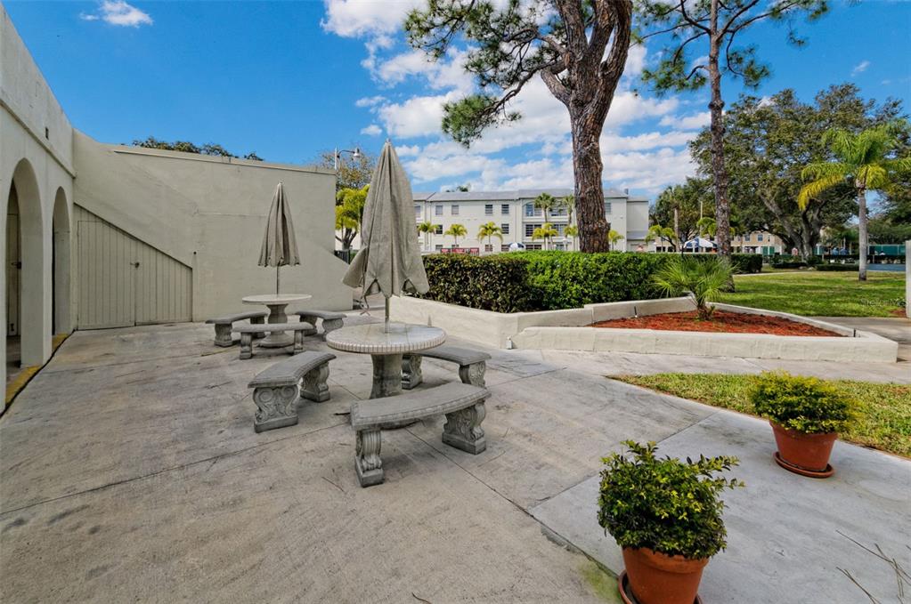 2700 Bayshore Boulevard, Unit 1302 Dunedin, FL 34698 - Photo 30 of 40 a view of a backyard with sitting area