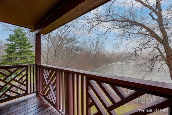 a view of balcony with wooden floor