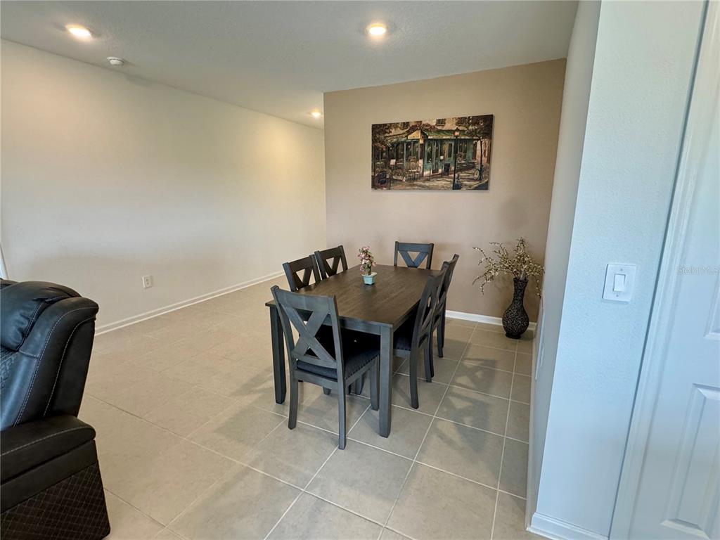 2405 Bluestone Road Haines City, FL 33844 - Photo 8 of 17 a view of a dining room with furniture