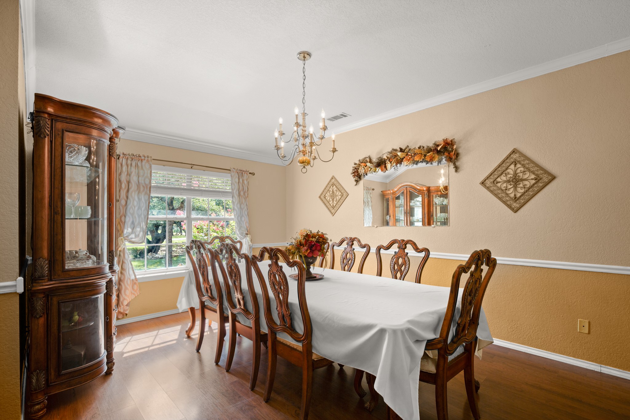 350 Lost River Road Georgetown, TX 78628 - Photo 16 of 39 Your elegant formal dining area features a chair rail and chandelier.