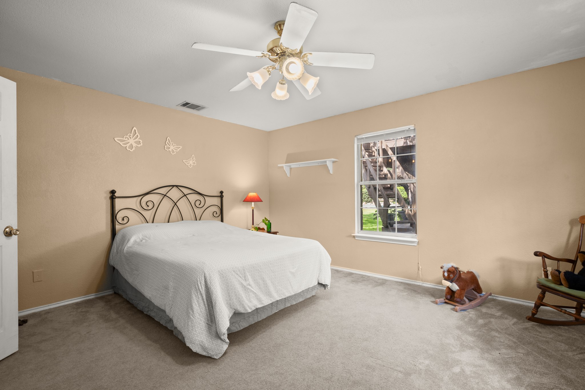 350 Lost River Road Georgetown, TX 78628 - Photo 21 of 39 Second bedroom with plush carpet and a ceiling fan.