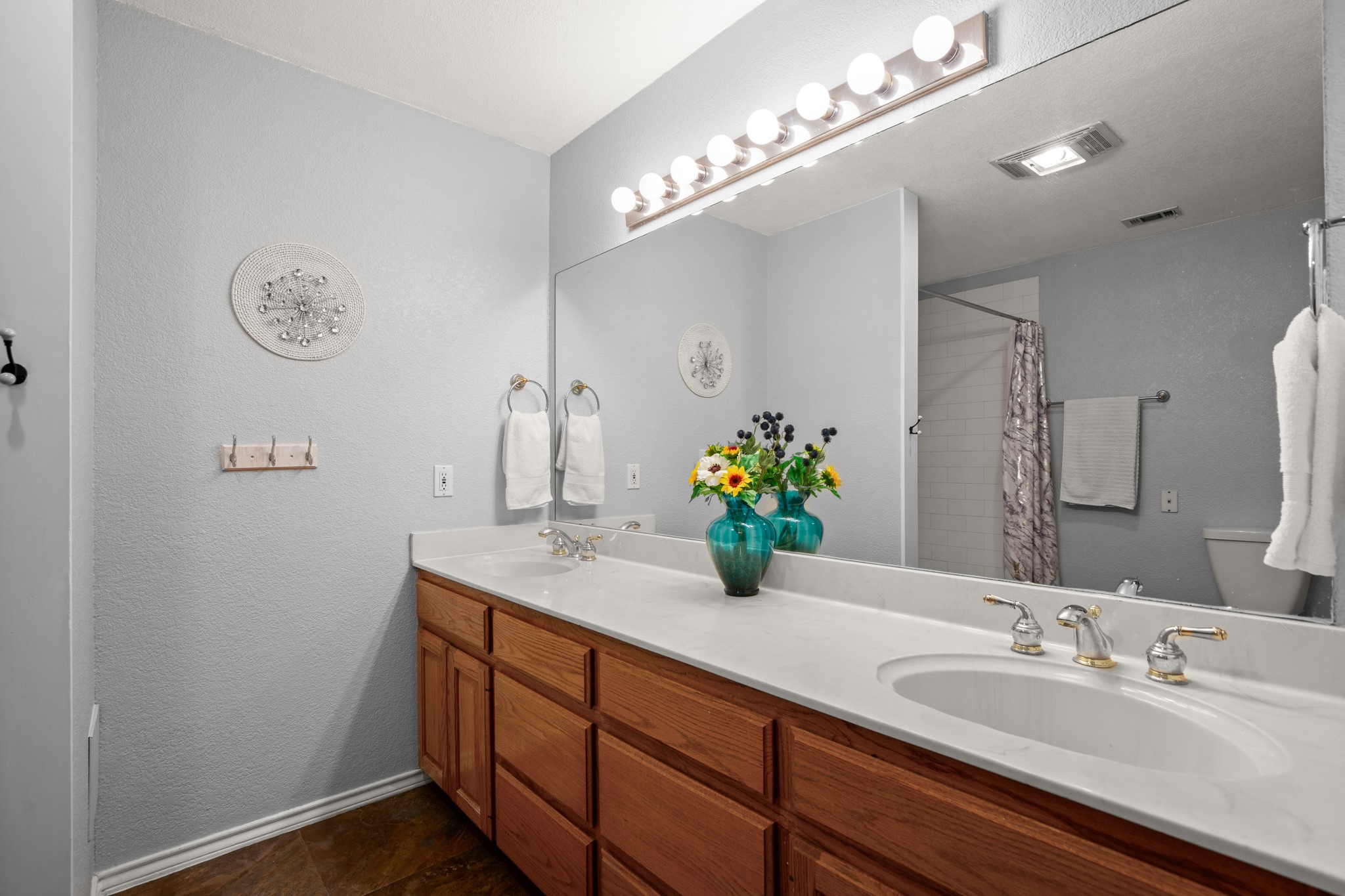 350 Lost River Road Georgetown, TX 78628 - Photo 30 of 39 The secondary bathroom has an extended double vanity and an updated shower.