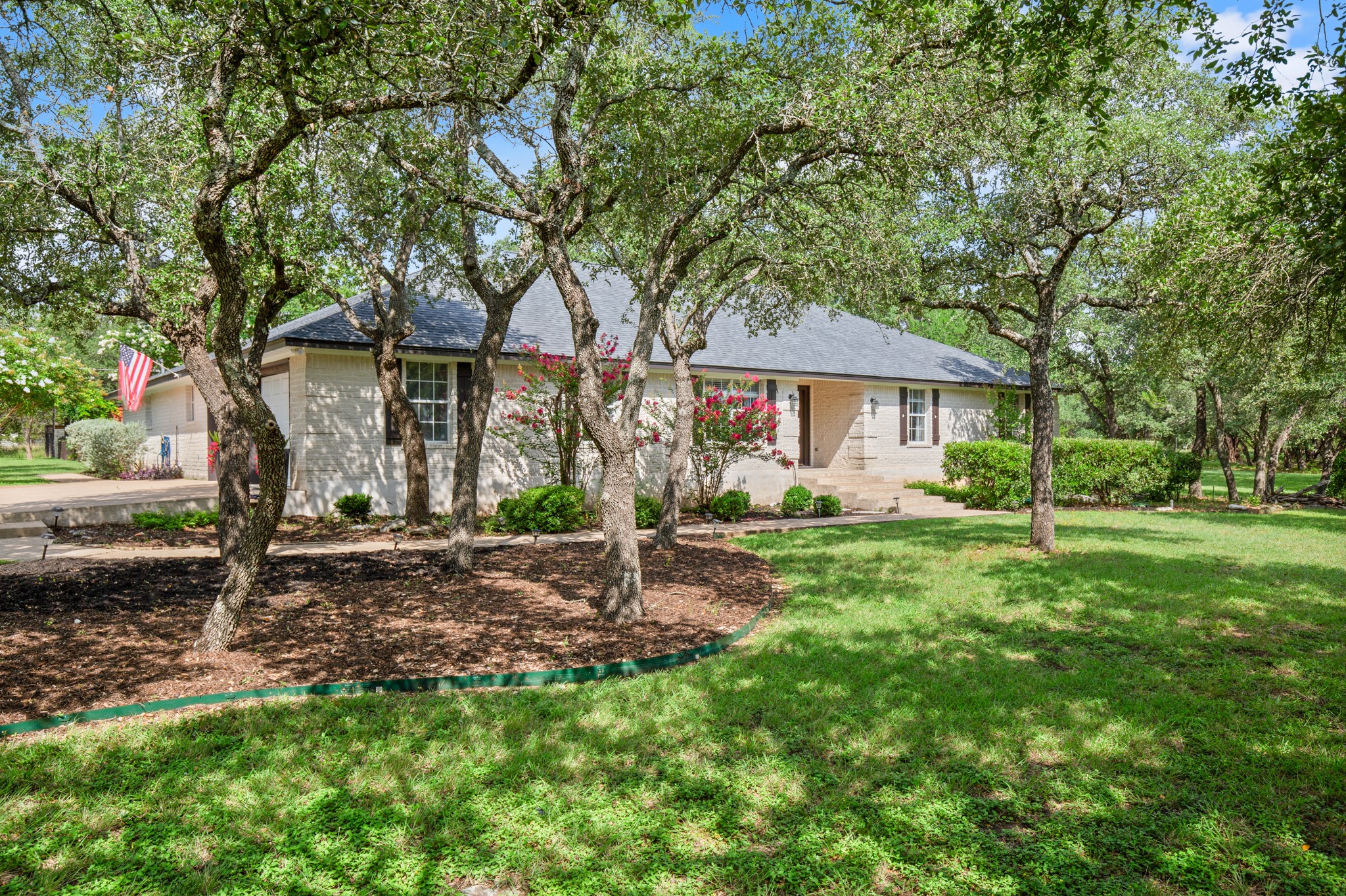 350 Lost River Road Georgetown, TX 78628 - Photo 5 of 39 Many shade trees offer beauty and precious shade.