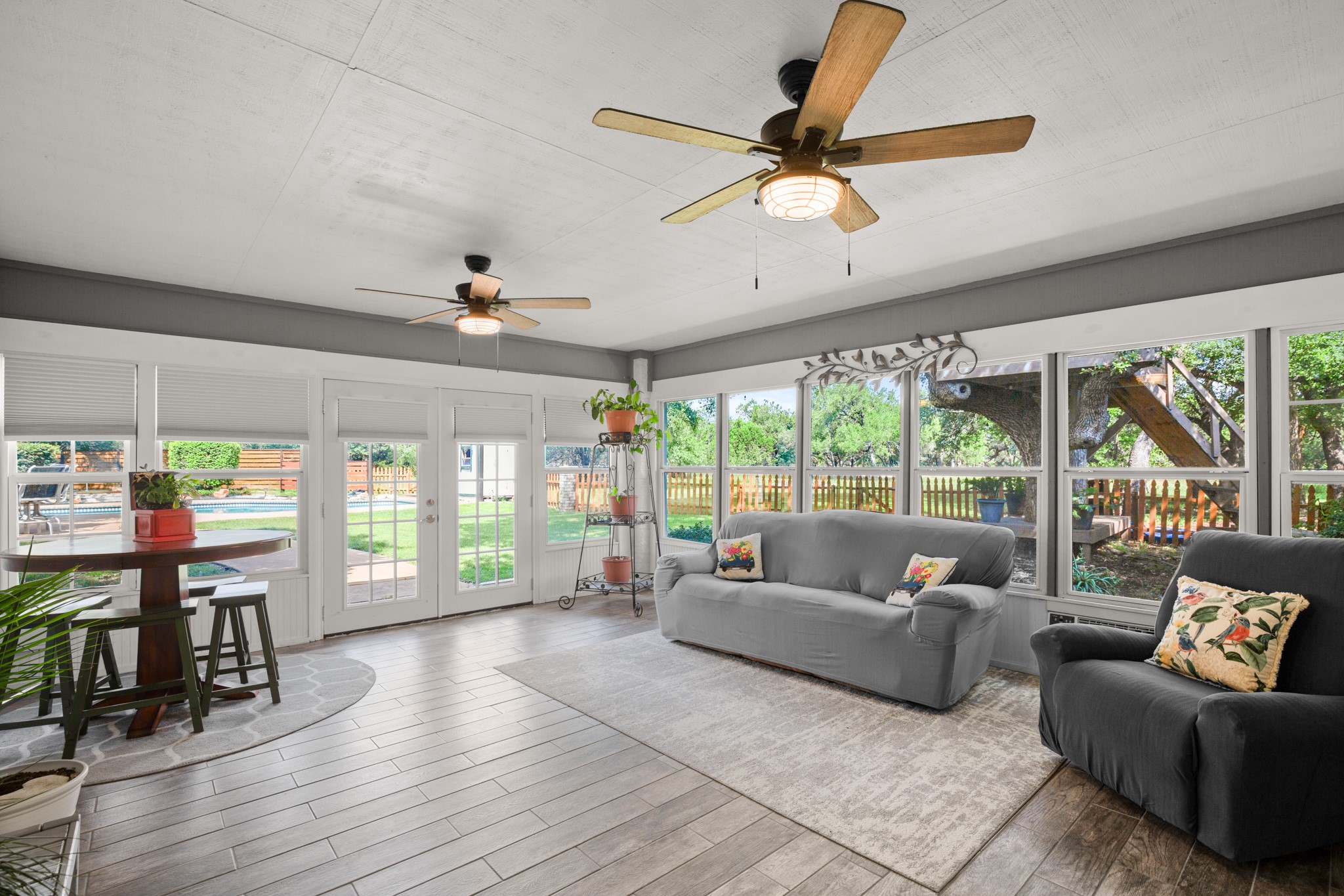 350 Lost River Road Georgetown, TX 78628 - Photo 6 of 39
Your patio has been enclosed, expansive glass walls provide an uninterrupted view of the landscape. and a window unit has been added for added comfort, making it the perfect spot to relax.