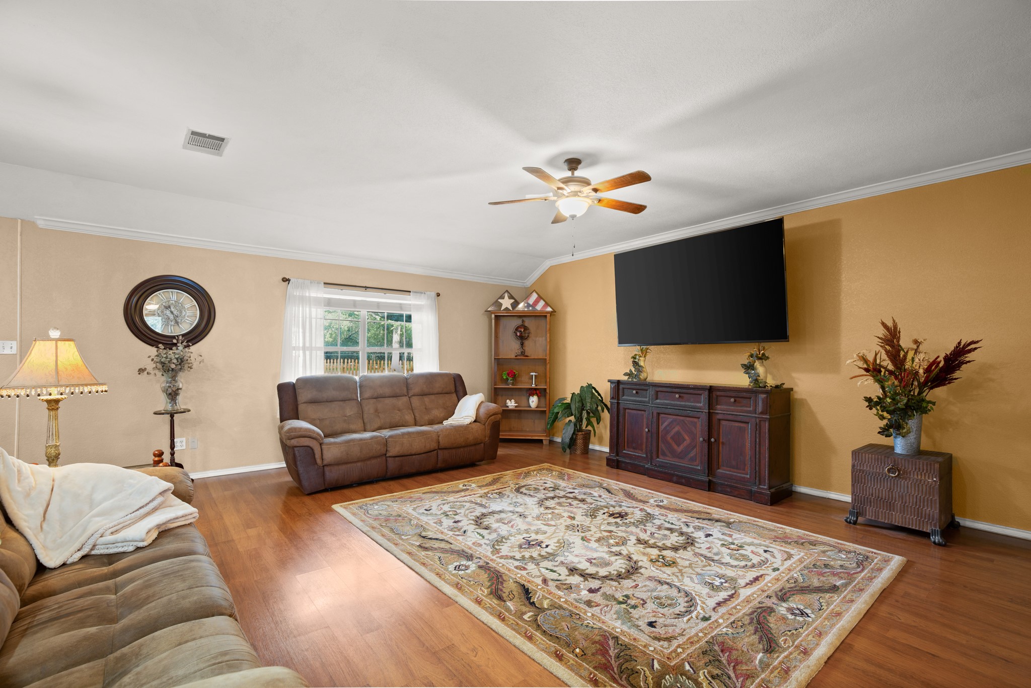 350 Lost River Road Georgetown, TX 78628 - Photo 10 of 39 The spacious living room, adorned with soaring ceilings and an abundance of natural light, offers a bright and airy atmosphere, perfect for relaxation or entertainment