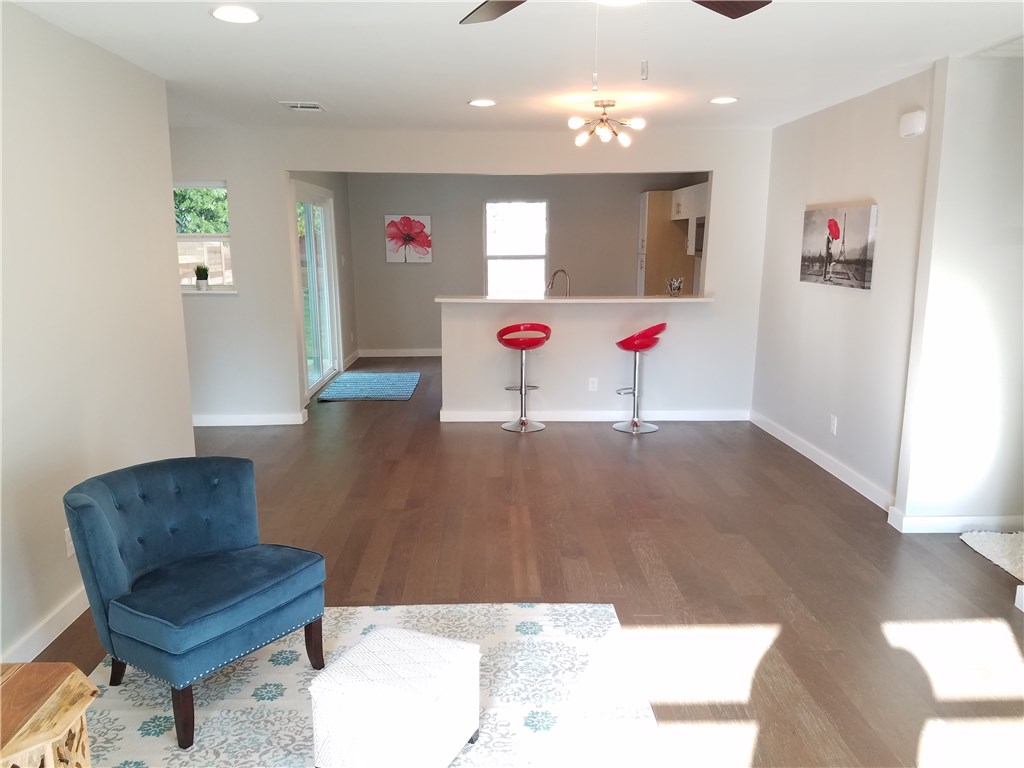 4702 Bandera Road Austin, TX 78721 - Photo 1 of 1 a living room with furniture and kitchen view