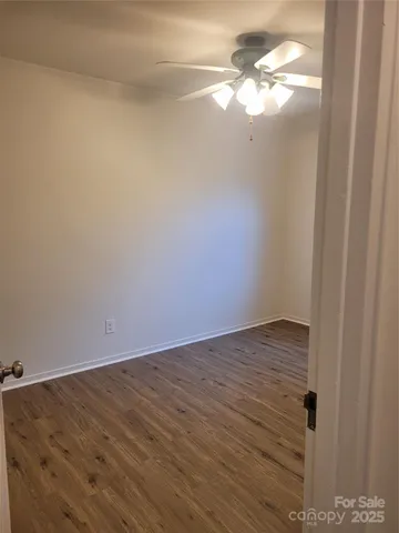 a view of a small space with wooden floor