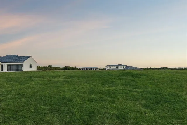 a view of a lake with a big yard