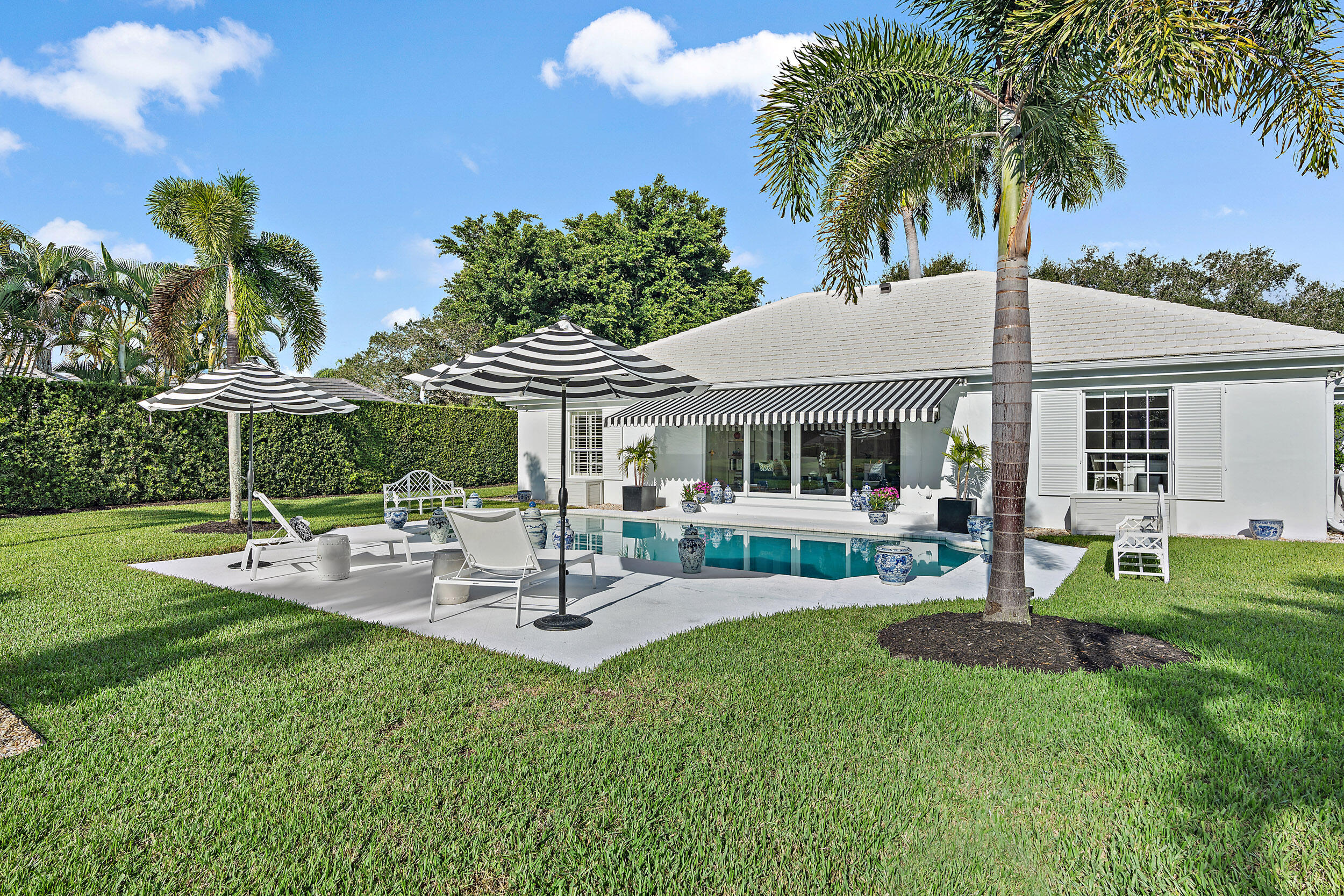 10182 Southeast Acorn Way Jupiter, FL 33469 - Photo 32 of 56 Back yard and pool