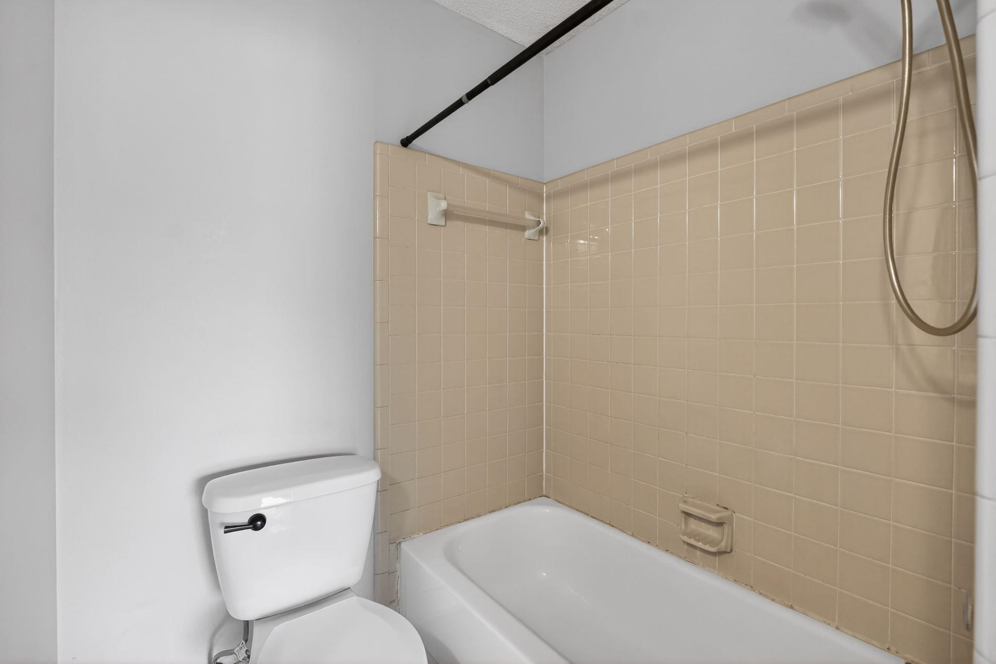 5581 Crepe Myrtle Drive Memphis, TN 38115 - Photo 25 of 33 Bathroom with shower / tub combination and toilet