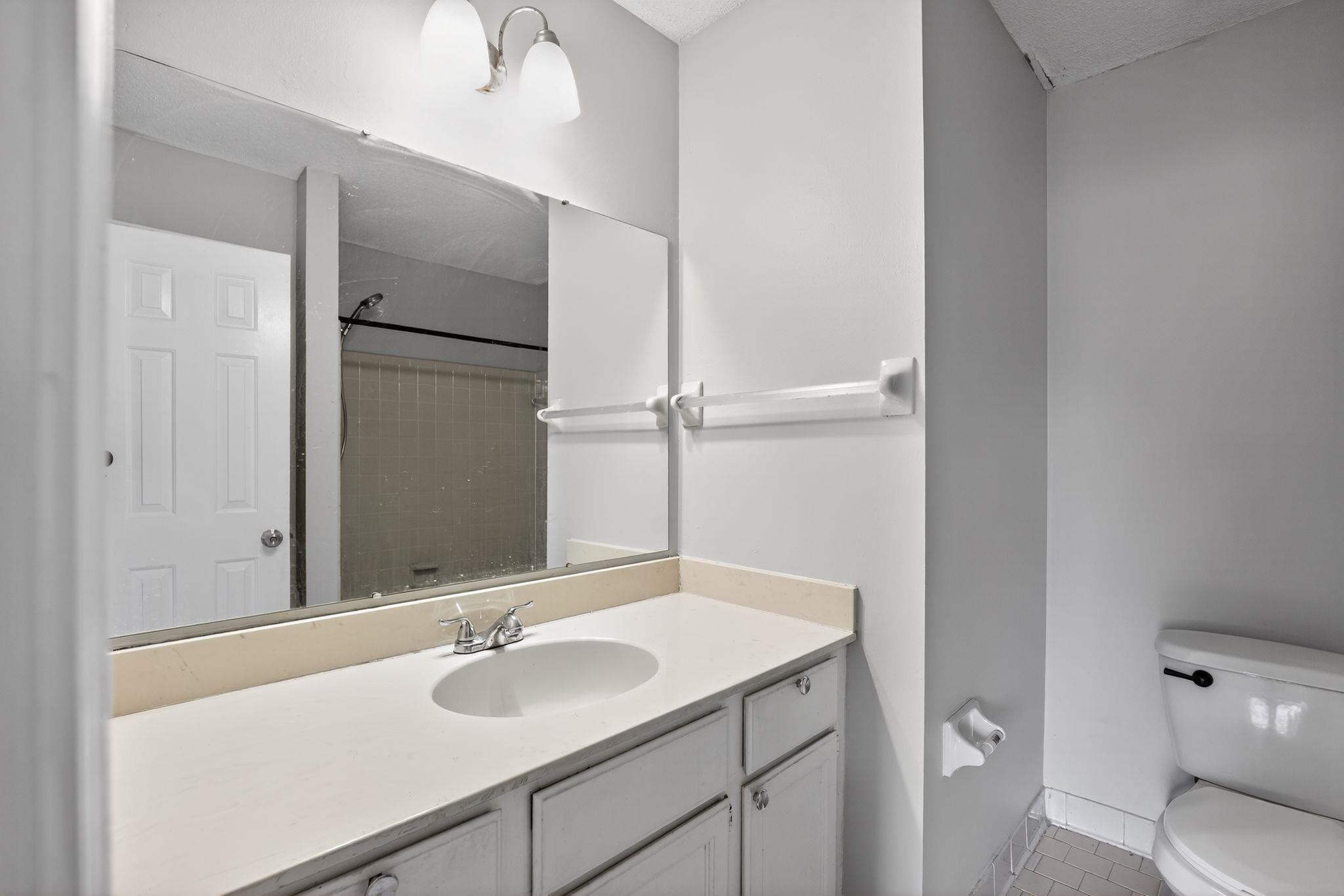 5581 Crepe Myrtle Drive Memphis, TN 38115 - Photo 27 of 33 Full bath featuring vanity, a shower, and tile patterned flooring