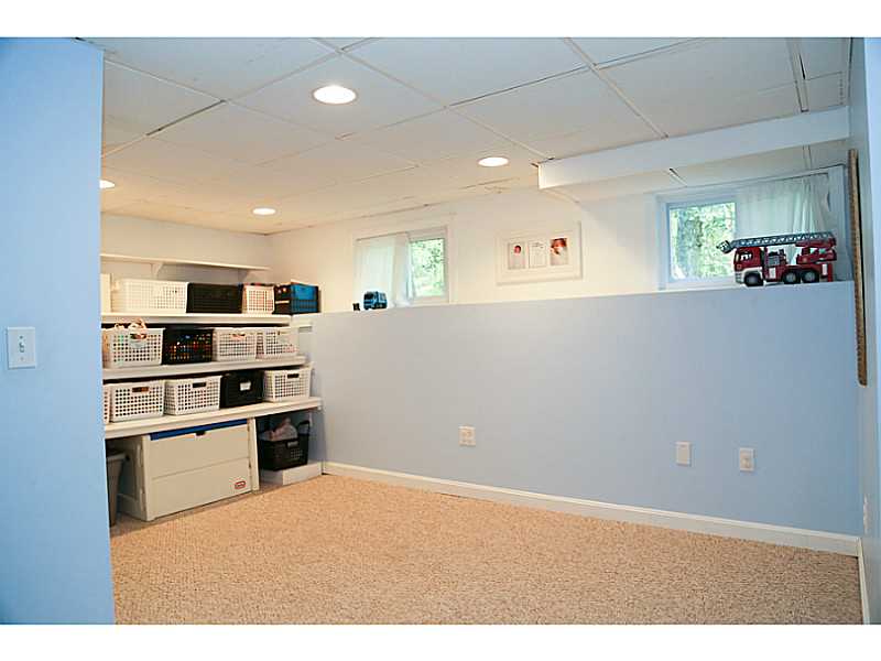 94 Hoxsie Road Richmond, RI 02892 - Photo 20 of 25 Exterior Front. Kids storage and playroom in basement.