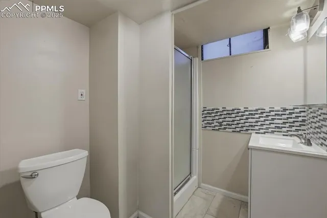 a bathroom with a toilet and a sink